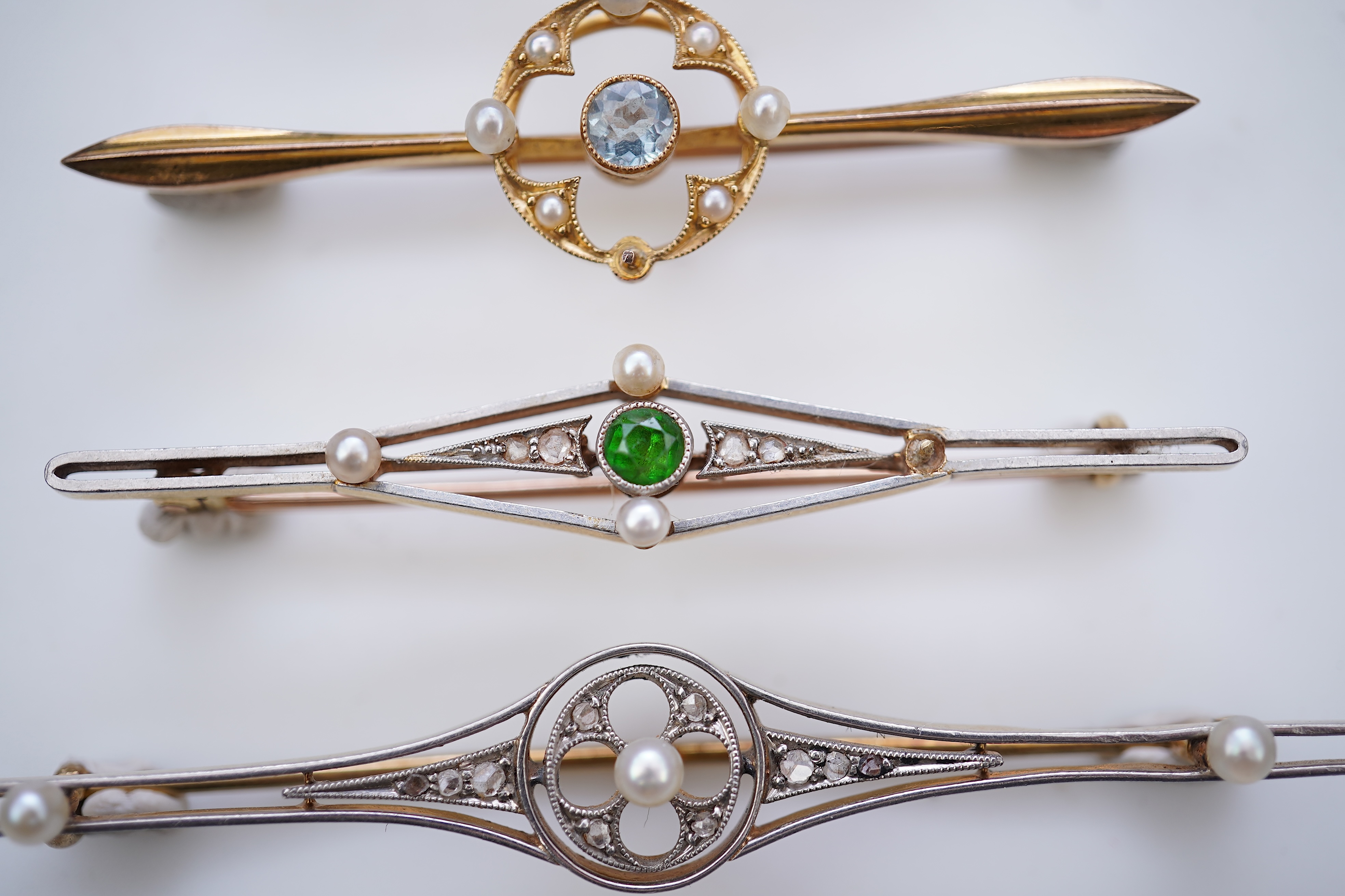 Four gold and gem-set bar brooches, early 20th century